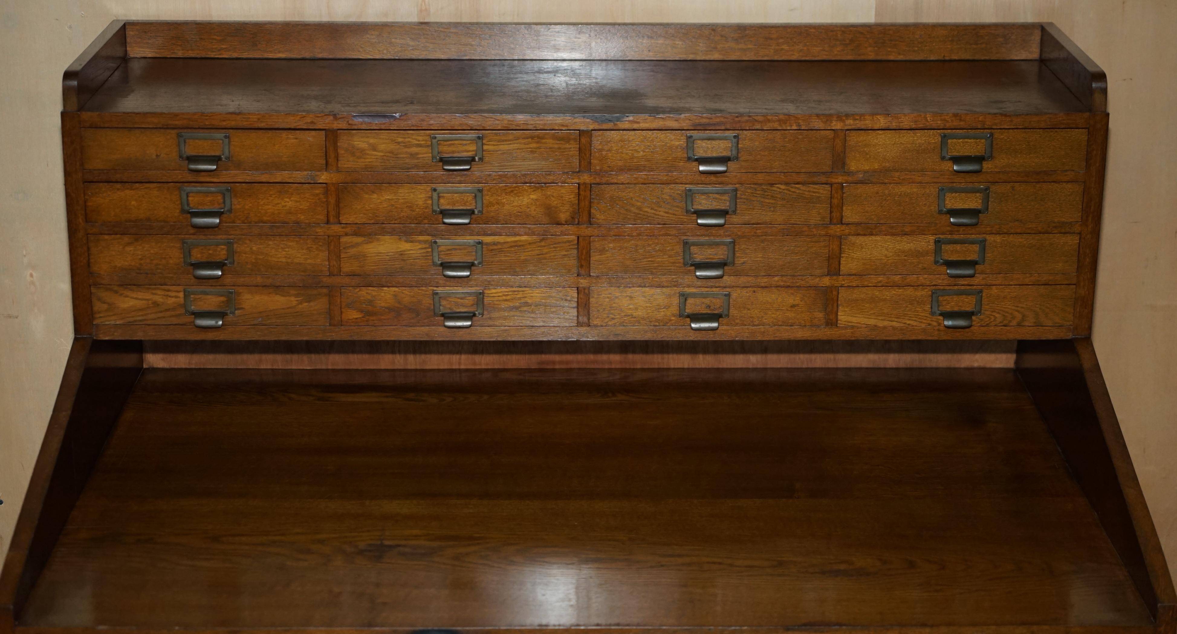 Antique English Art Deco furniture in hand-carved oak, 26 drawers.