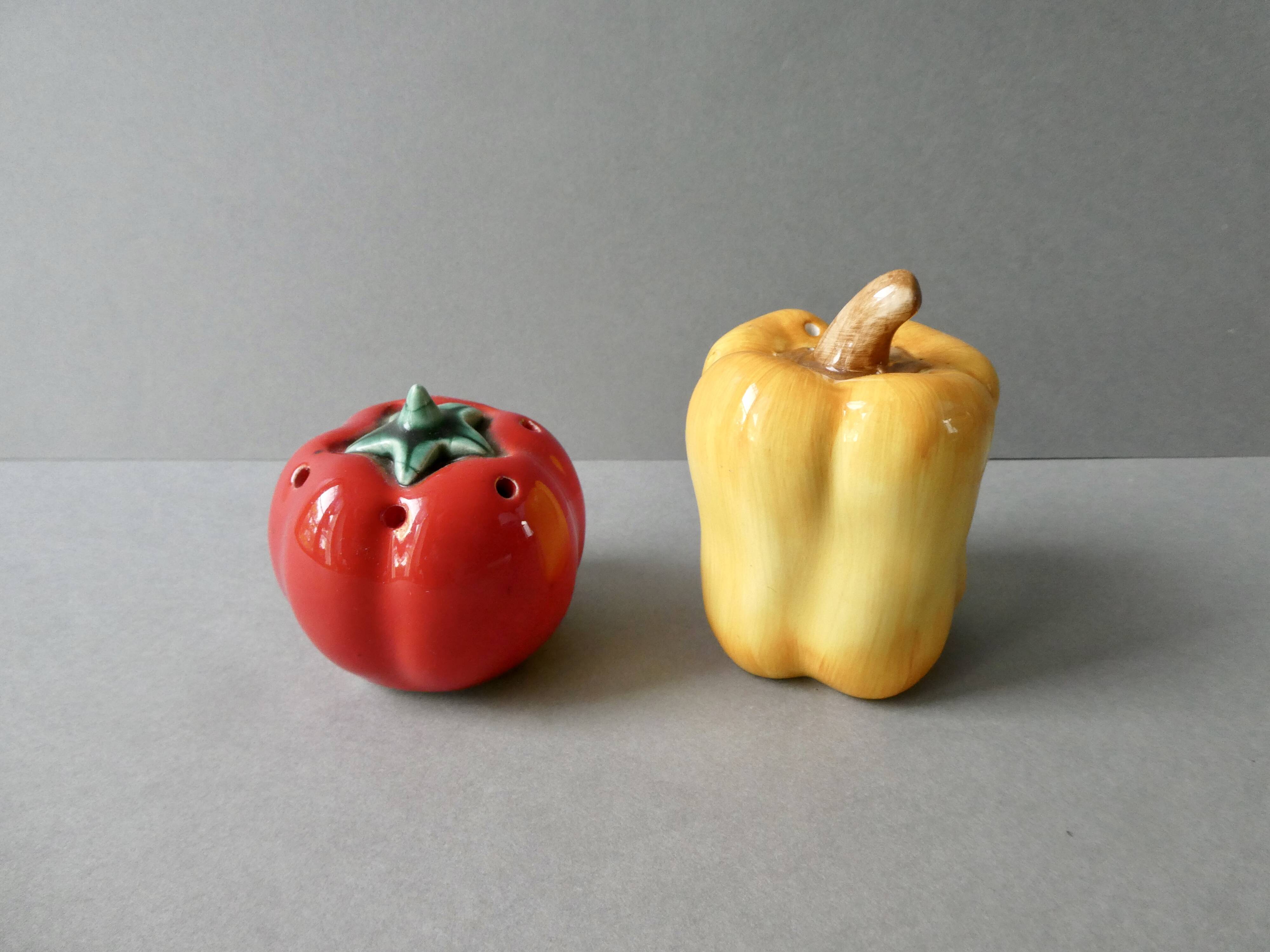 Salt and pepper shakers in barbotine, pepper and tomato shape