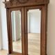 Antique solid wood wardrobe with mirror doors.