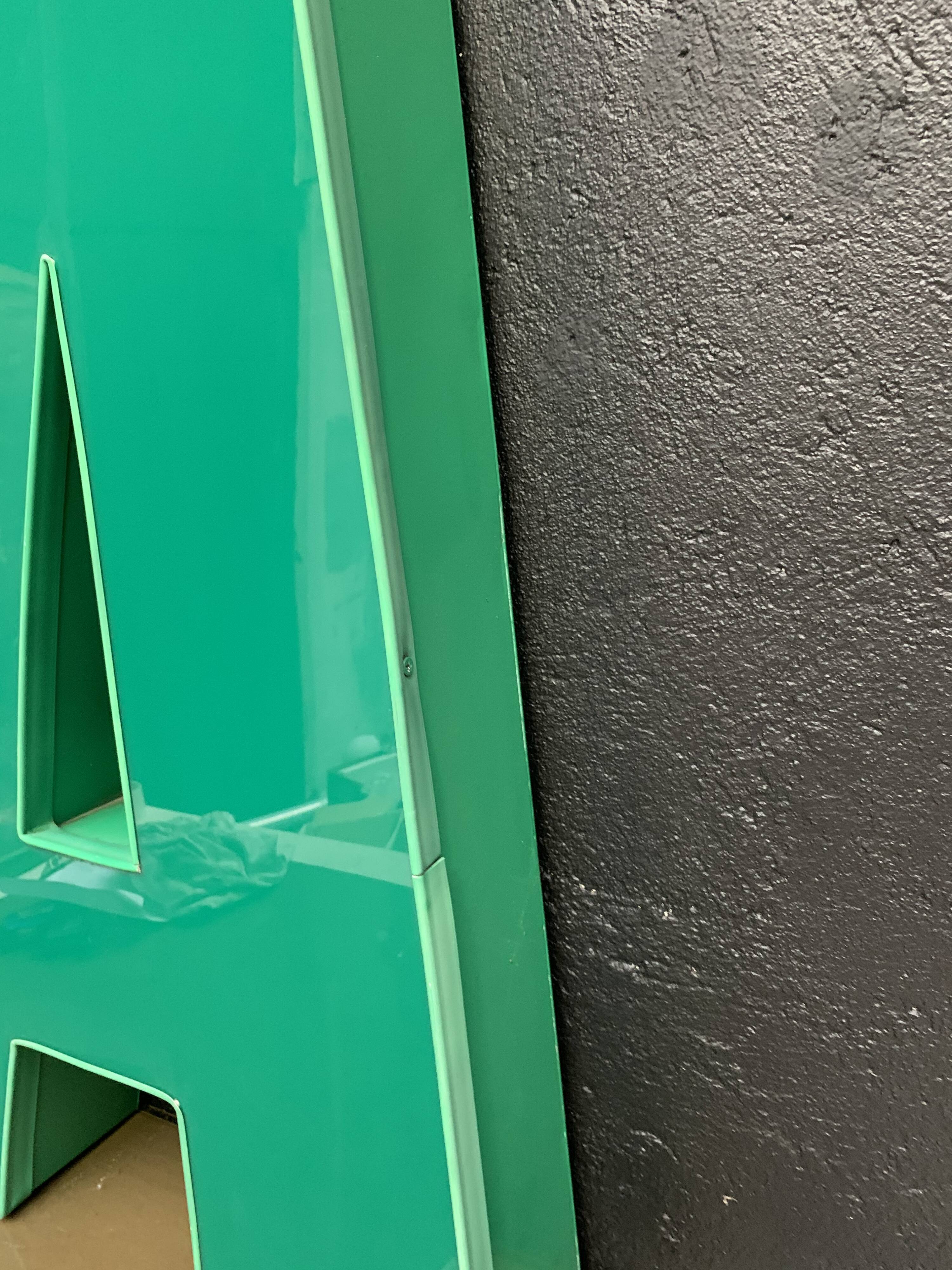 Old letter in metal and plexiglass, industrial decoration
