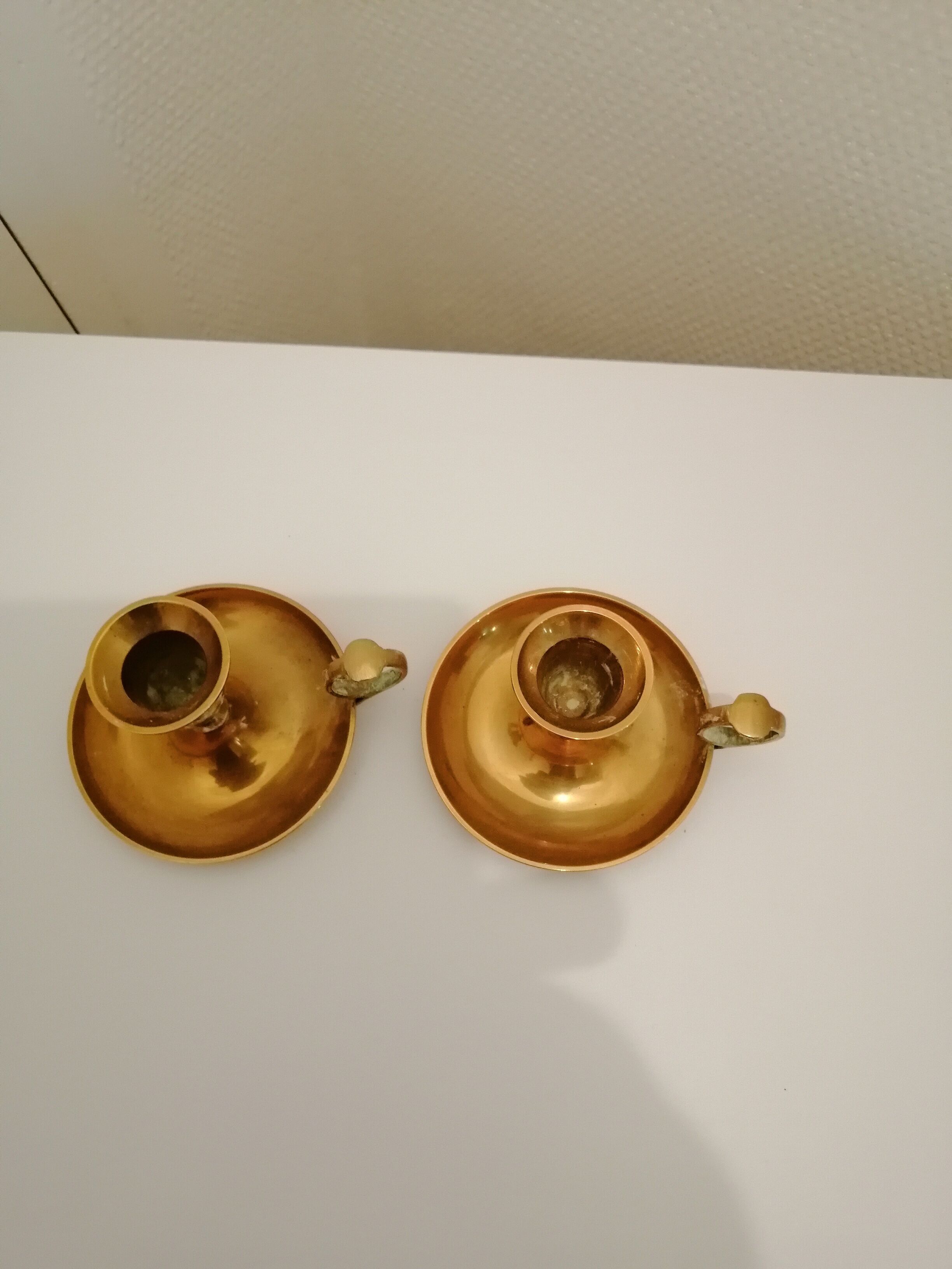 A PAIR OF SMALL COPPER CANDLE HOLDERS