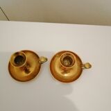 A PAIR OF SMALL COPPER CANDLE HOLDERS