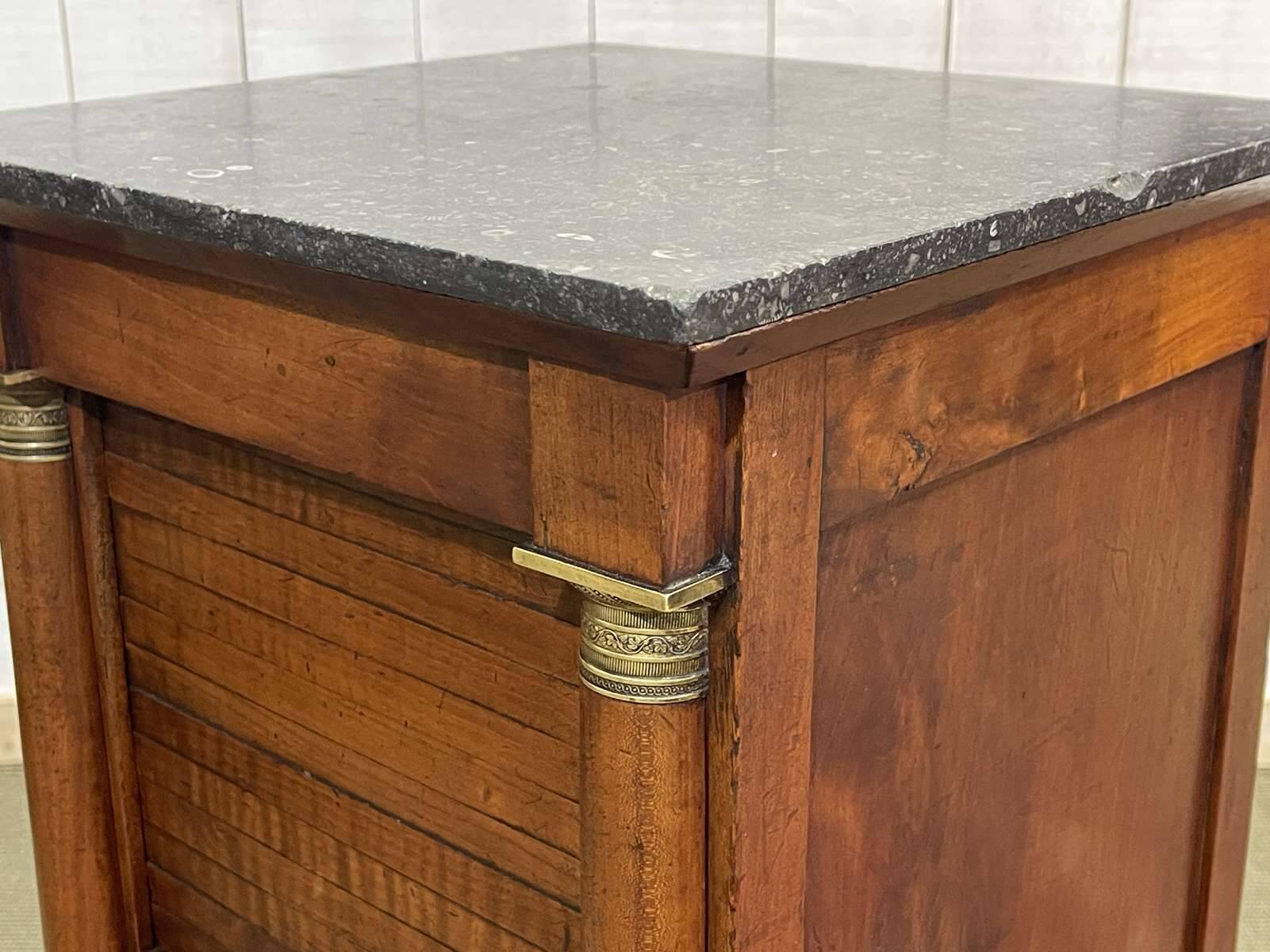 Empire bedside table from the 19th century in cherry wood and black marble.