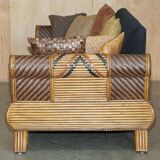 Vintage 1970s canapé with bamboo frame and Aztec patterns.