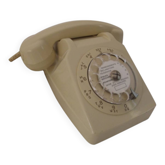 Téléphone beige rotatif