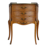 Baroque style wooden chest of drawers with bronze frieze.