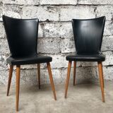 Pair of Baumann model Essor chairs in faux black leather, beech compass footing