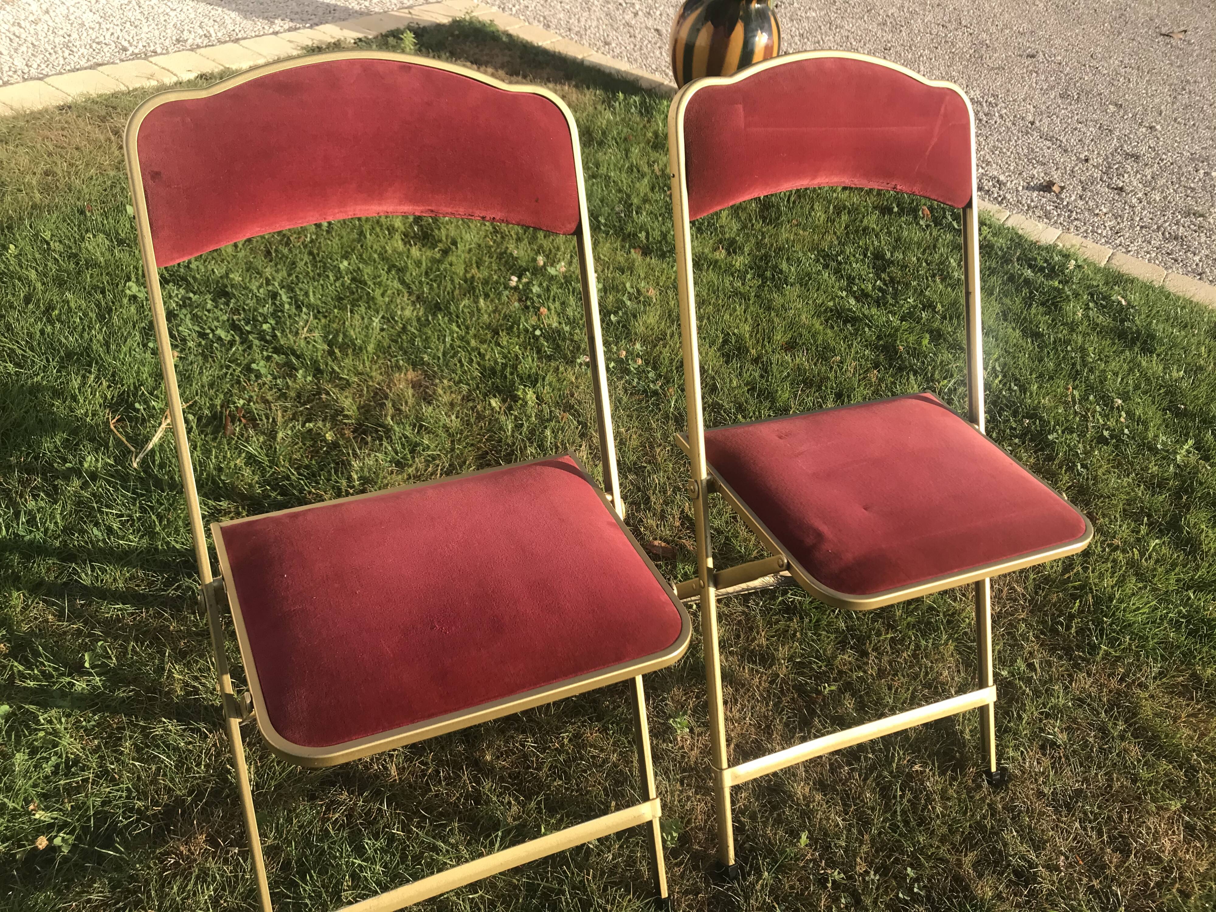 Pair of foldable red velvet chairs