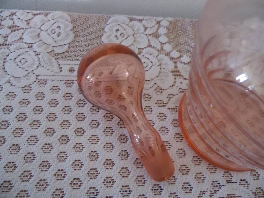 Pink transparent glass carafe with bubble cap