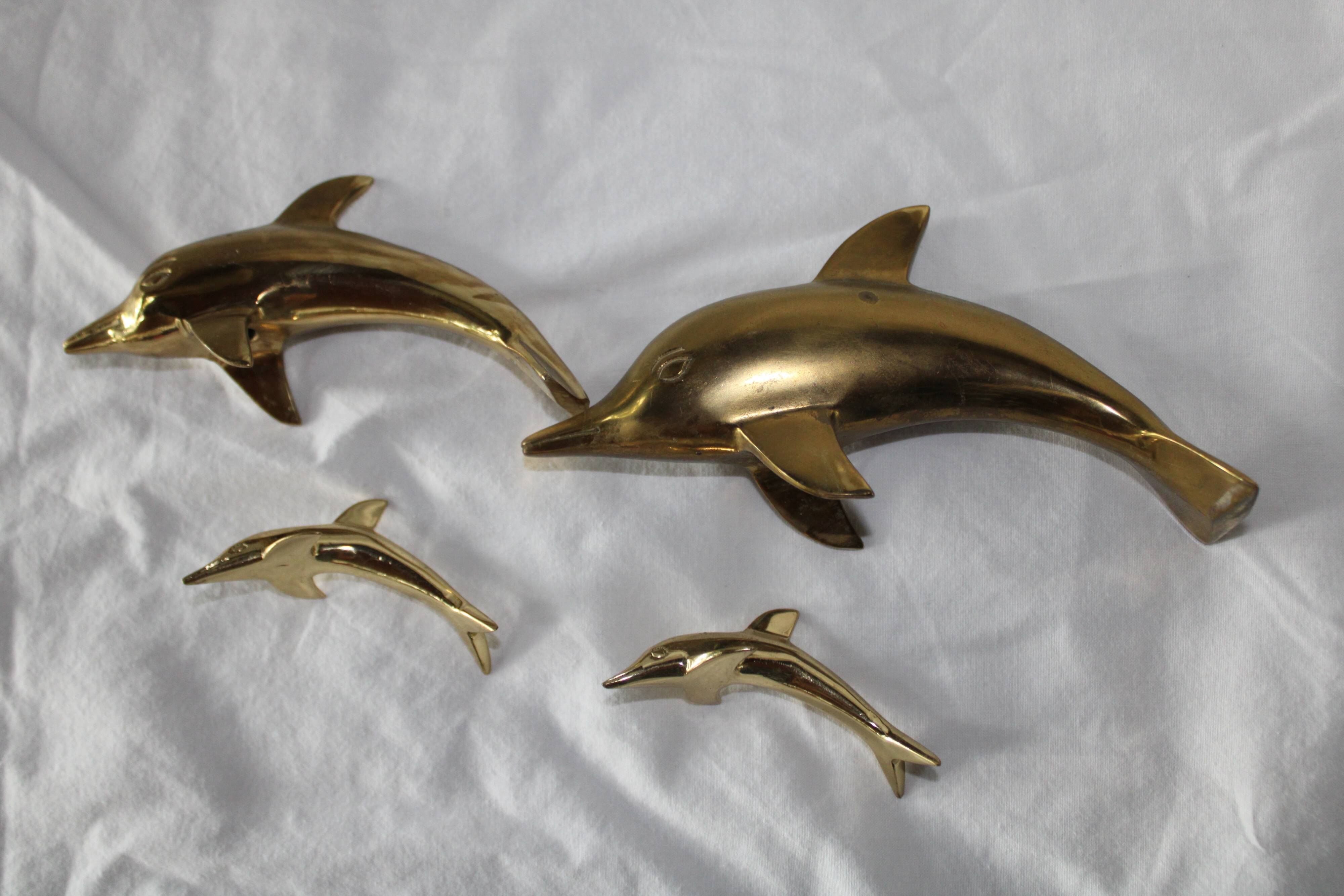 Family of dolphins in vintage brass