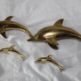 Family of dolphins in vintage brass