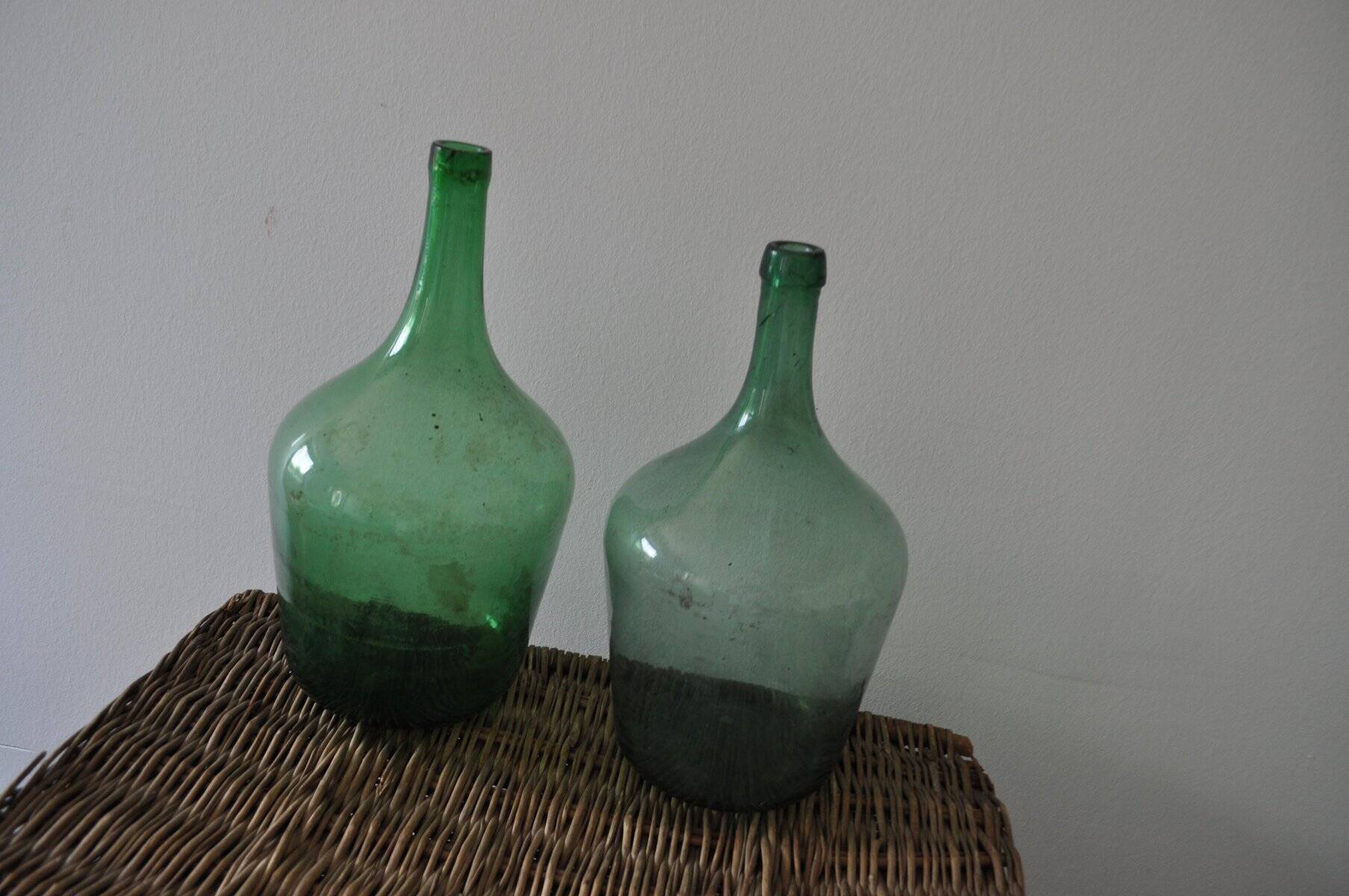 Pair of vintage green glass bottles — Hungarian carboys from the 1960s.