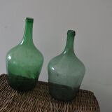 Pair of vintage green glass bottles — Hungarian carboys from the 1960s.
