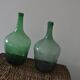 Pair of vintage green glass bottles — Hungarian carboys from the 1960s.