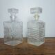 Mismatched pair of whisky decanters.