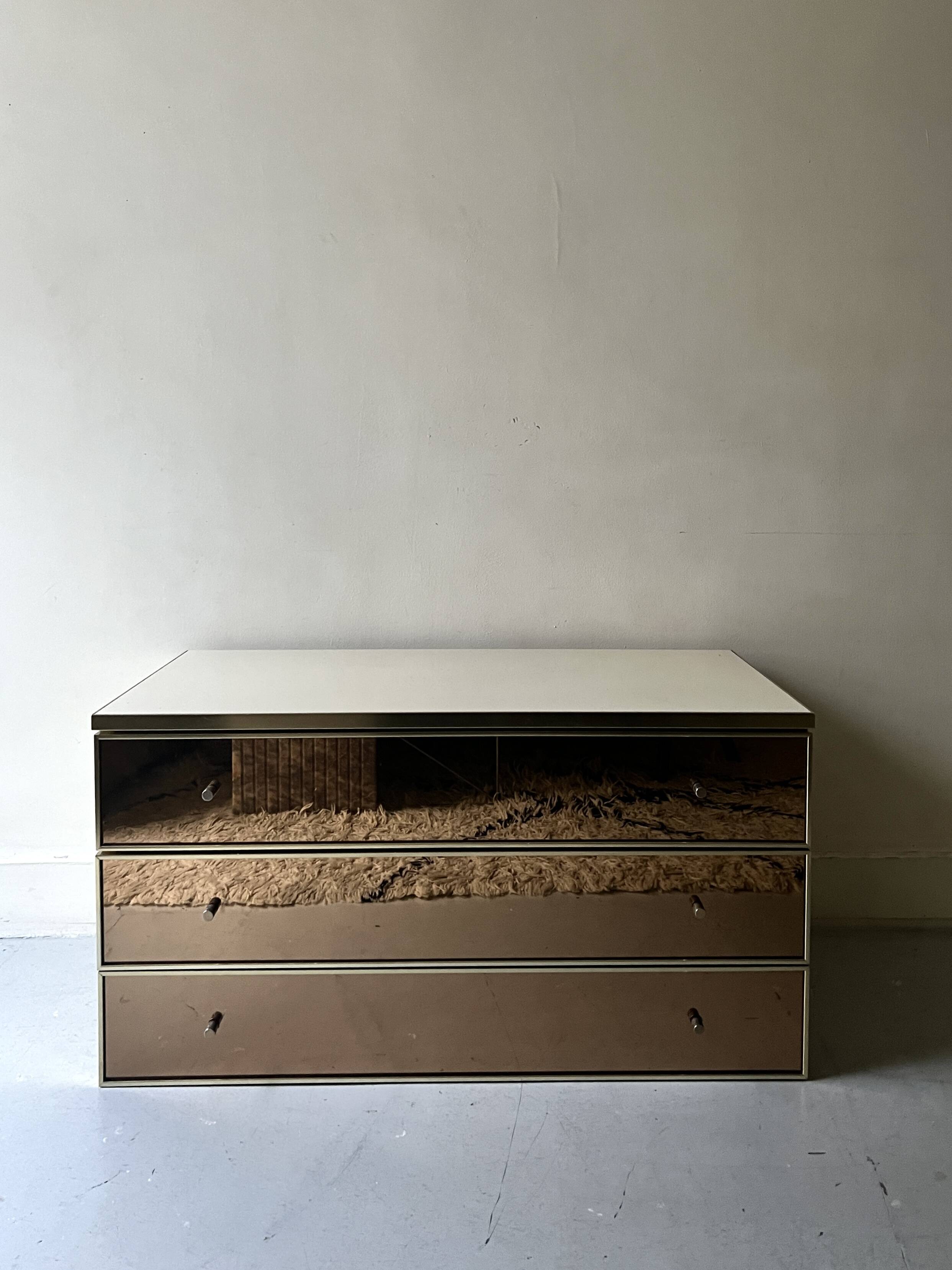 Ivory lacquered sideboard with polished finish and smoked mirror, JC Mahey design 1970.