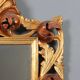 Antique baroque style mirror in carved wood, Italy, 20th century.