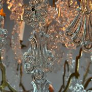 Bronze cage chandelier adorned with molded glass pendants in the shape of peacock feathers, circa 1800