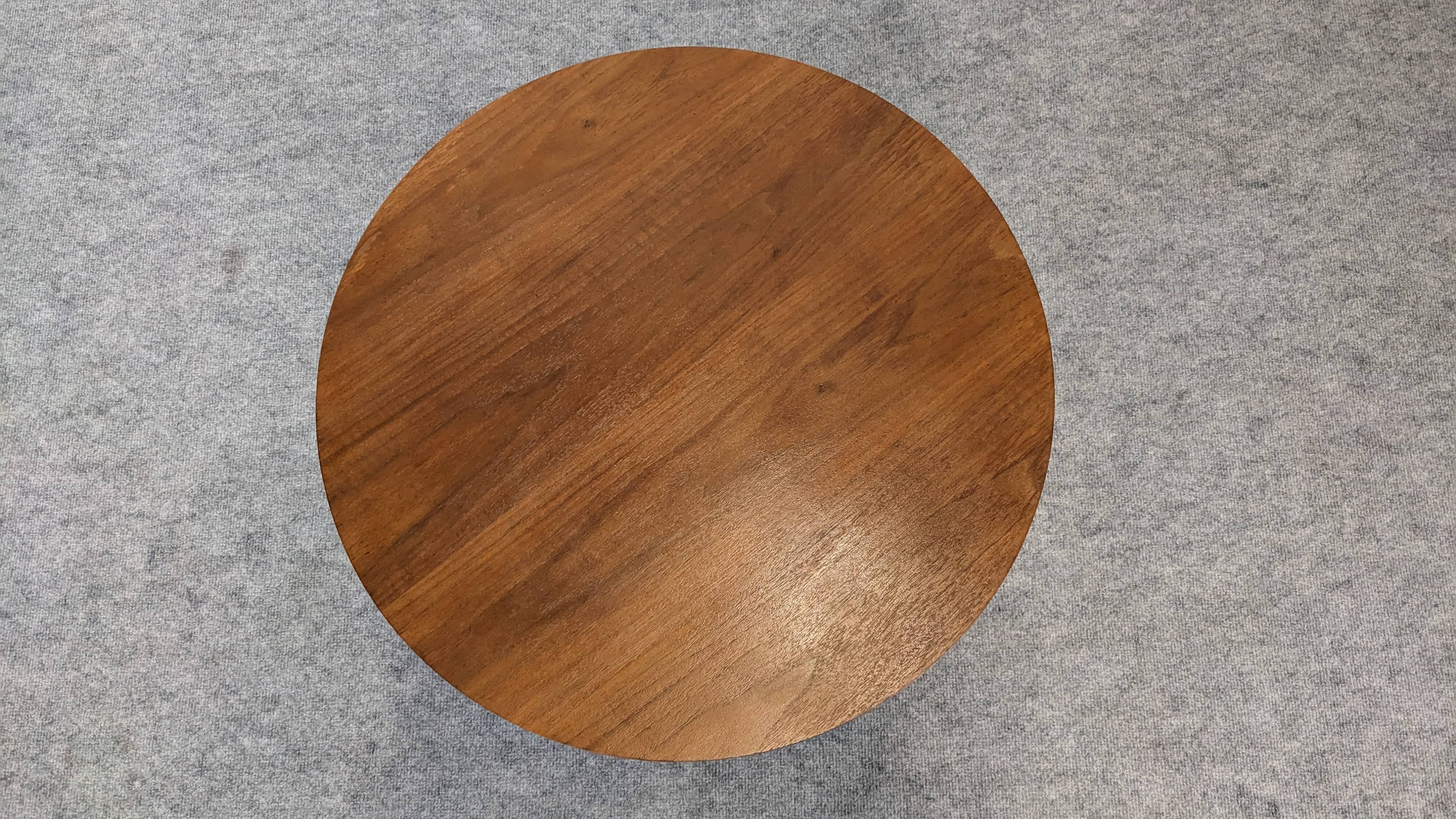 Contemporary round side table or end table.