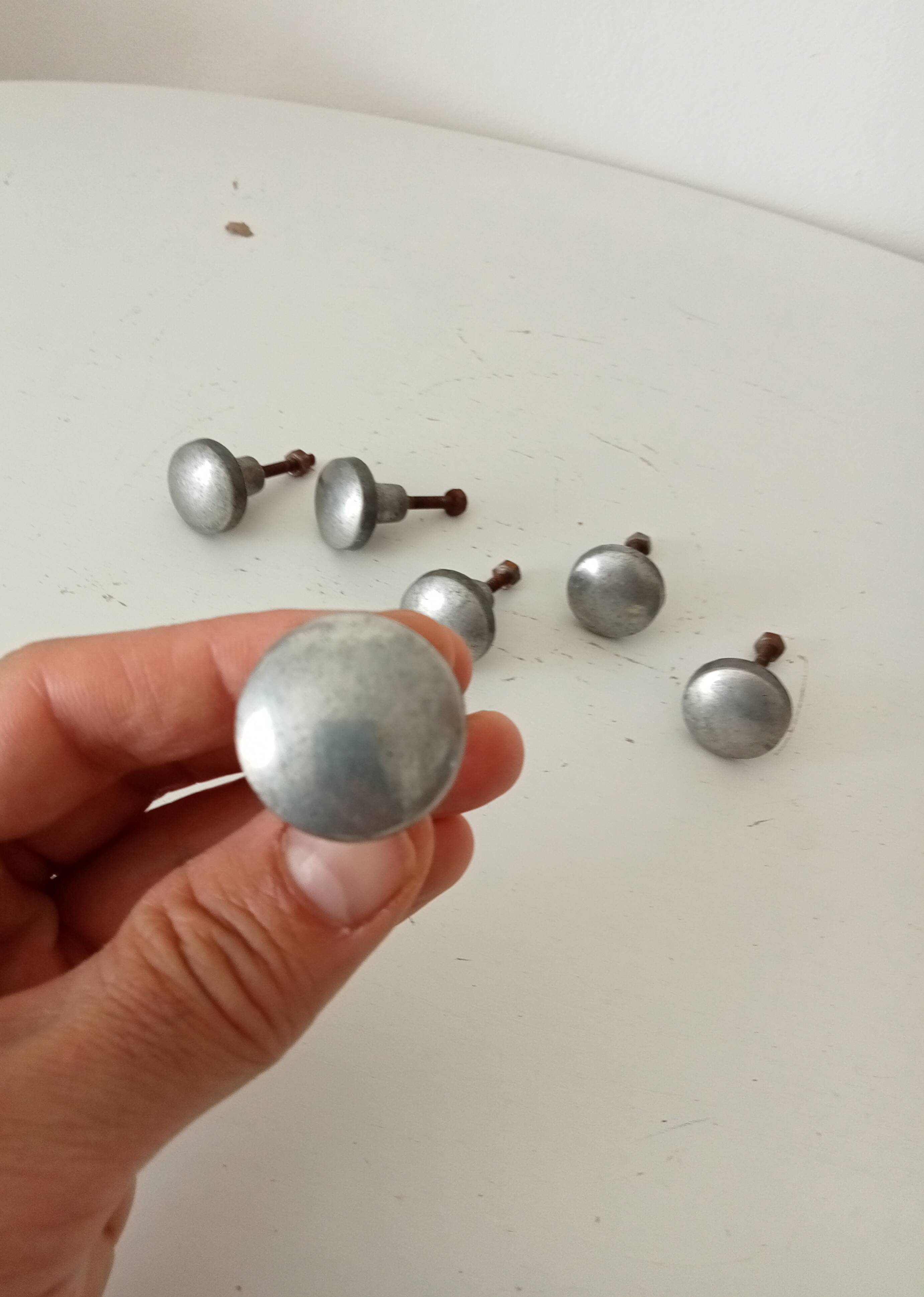 Pair of antique solid aluminium furniture handles.