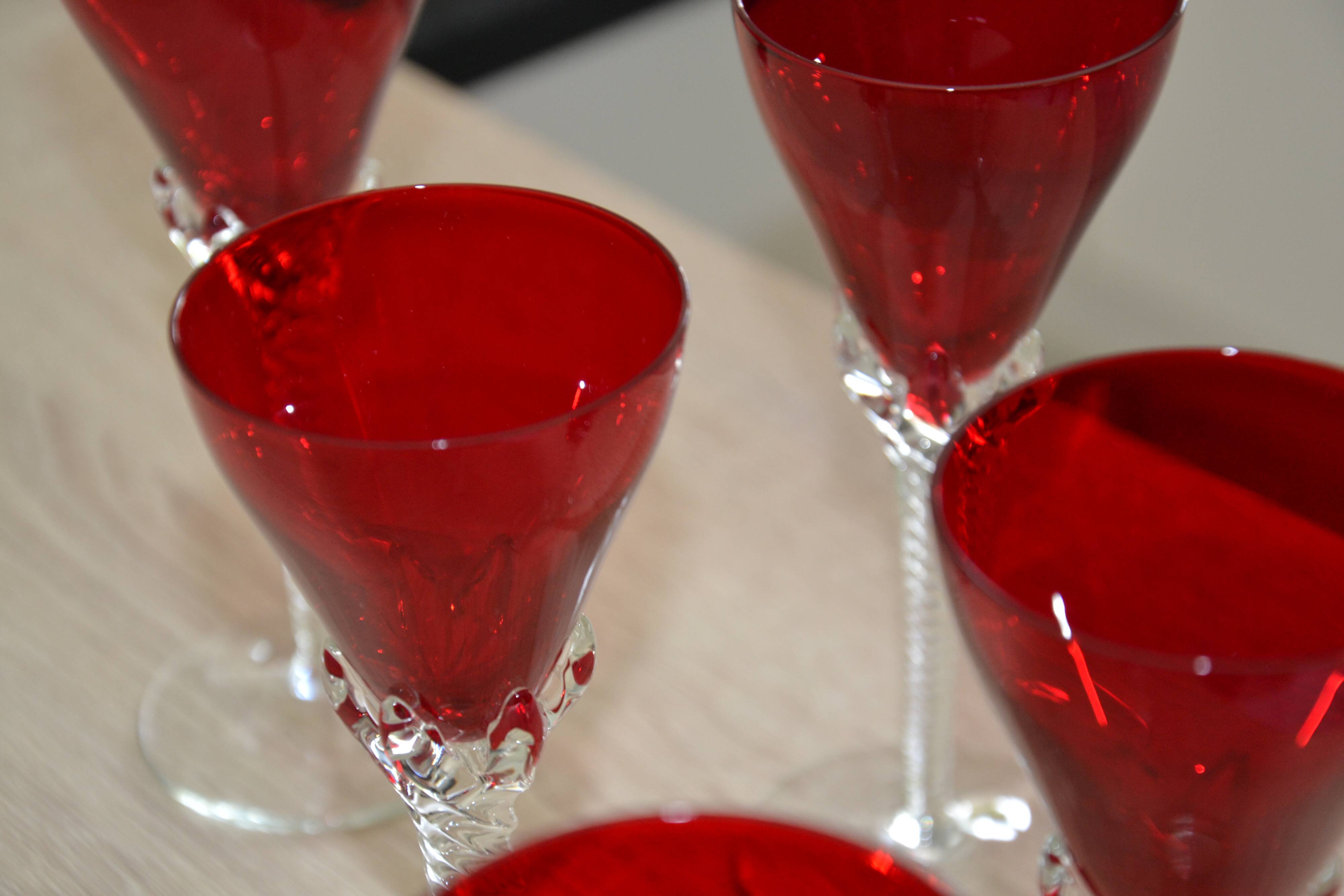5 red crystal glasses with twisted stems