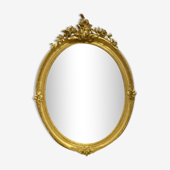 Miroir oval en bois doré 70x49cm