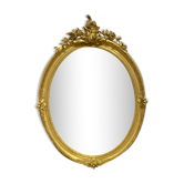 Oval mirror in gilded wood 70x49cm