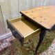 Table console de style Louis XV en bois noirci.