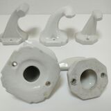 Five art deco white porcelain hooks