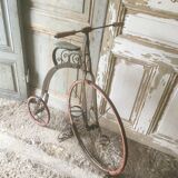 Bi child 1900 in metal and wood on base