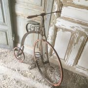 Bi child 1900 in metal and wood on base