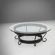 Rustic round coffee table with wrought iron base and glass top, France, 1930s
