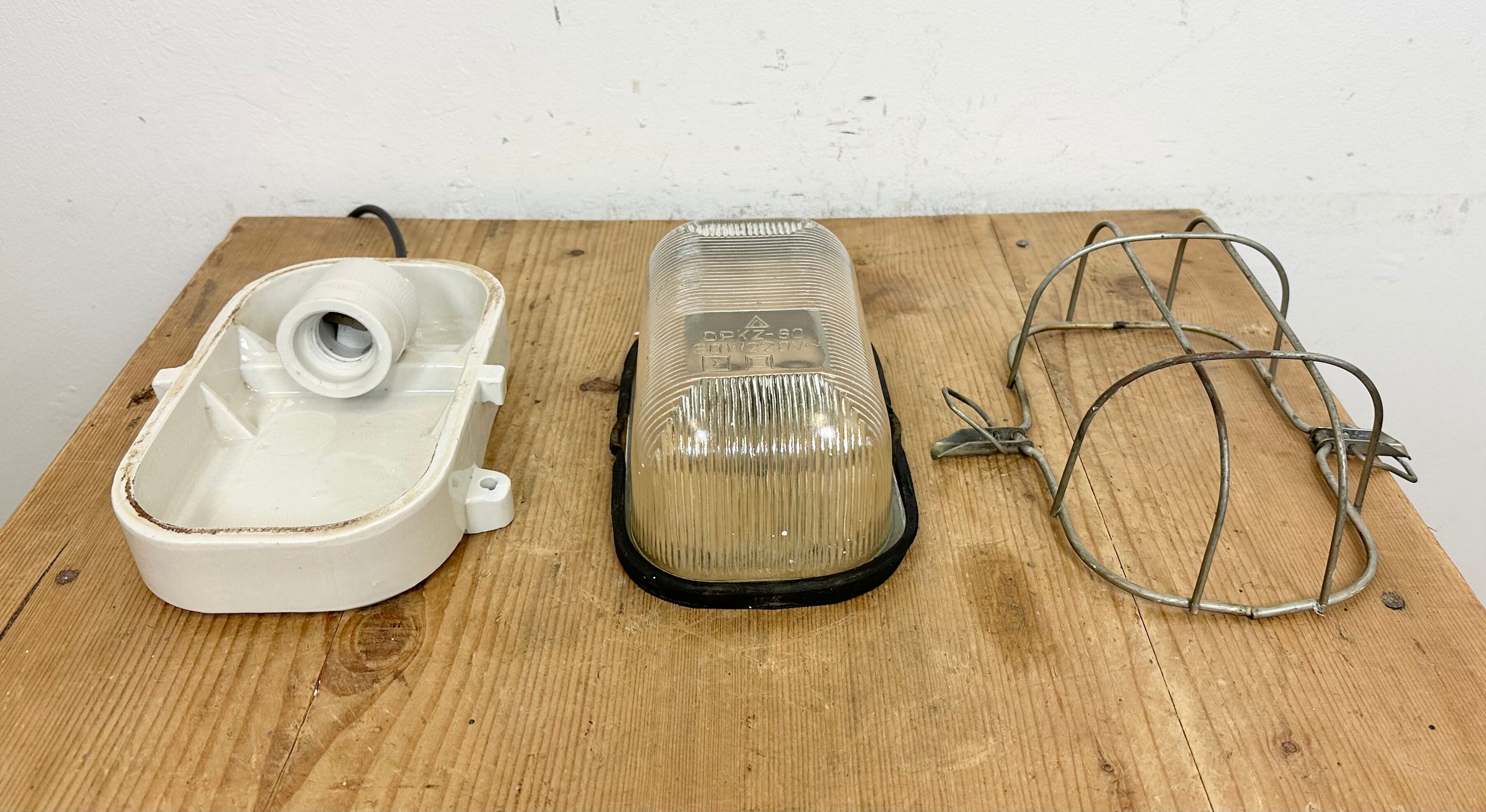 Industrial white porcelain cage wall light with ribbed glass, 1970s