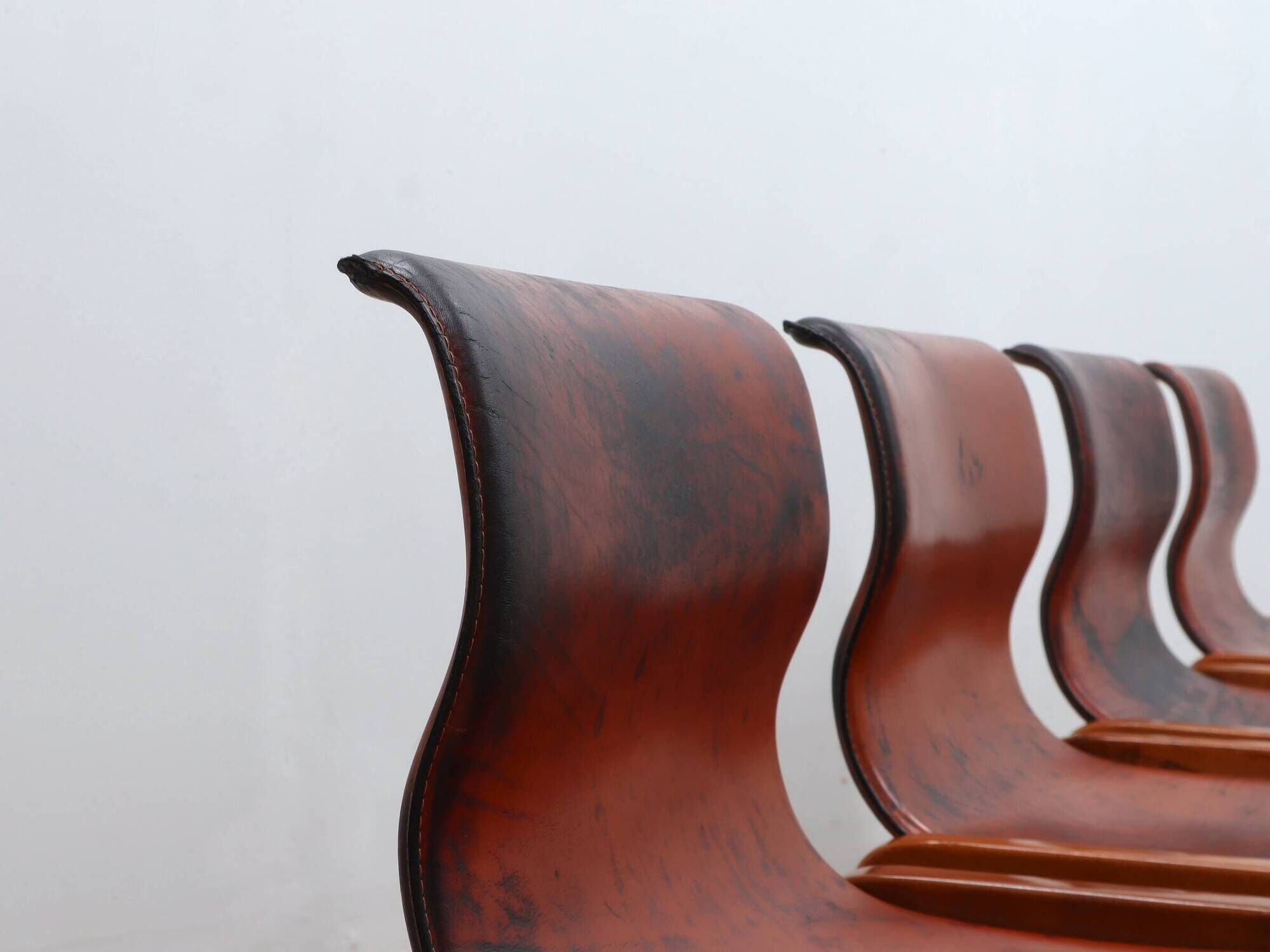 Curved wooden and leather chairs by Afra and Tobia Scarpa from the 1970s, set of 4.