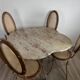 Ensemble table + 4 chaises fer forgé patiné, plateau granit Kashmir, cannag