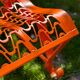 Orange pierced sheet metal bench