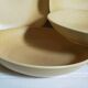 Five vintage natural stoneware soup plates