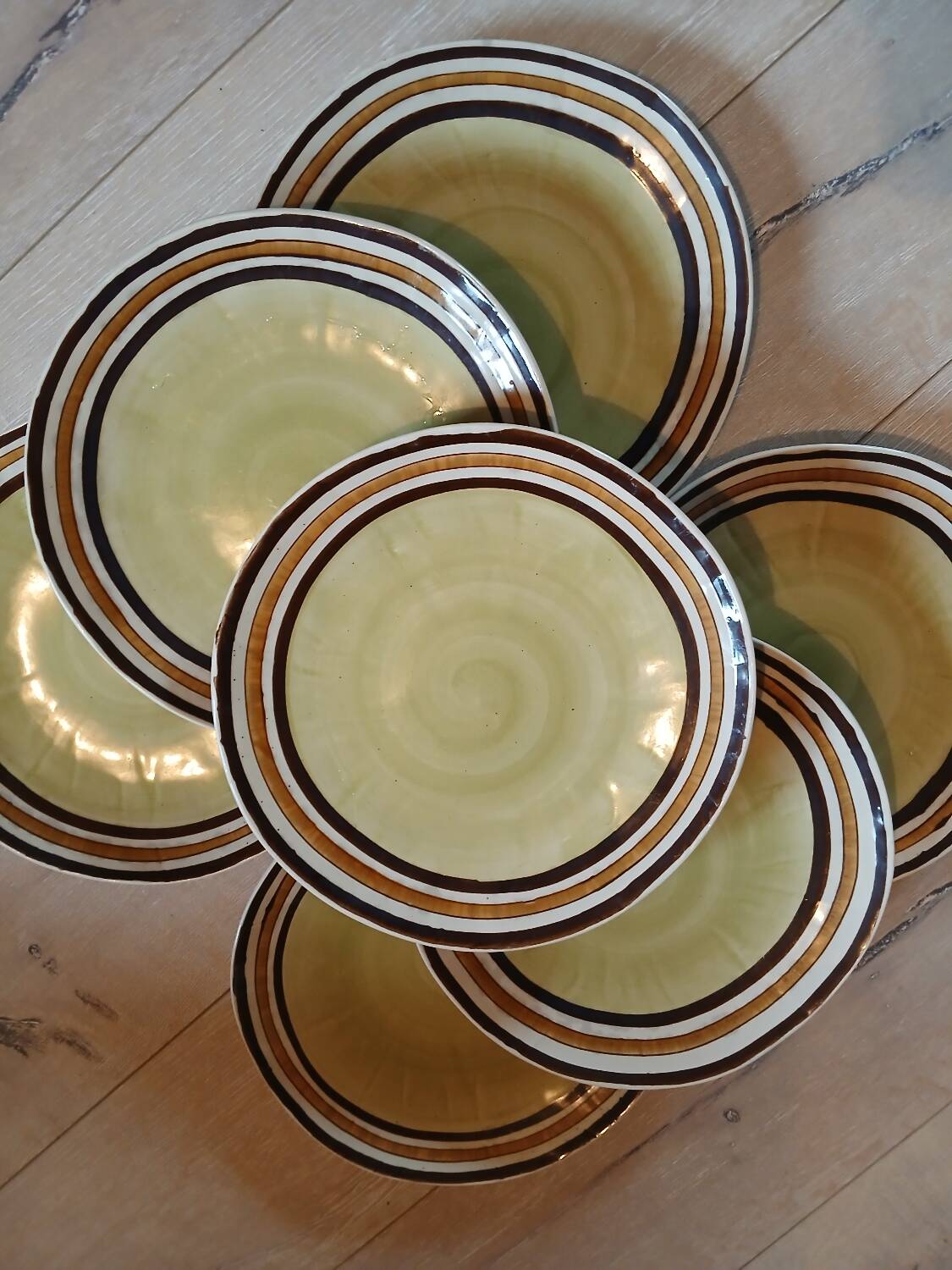 7 old stoneware flat plates