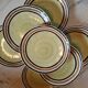 7 old stoneware flat plates