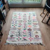 White Moroccan rug with Berber patterns.