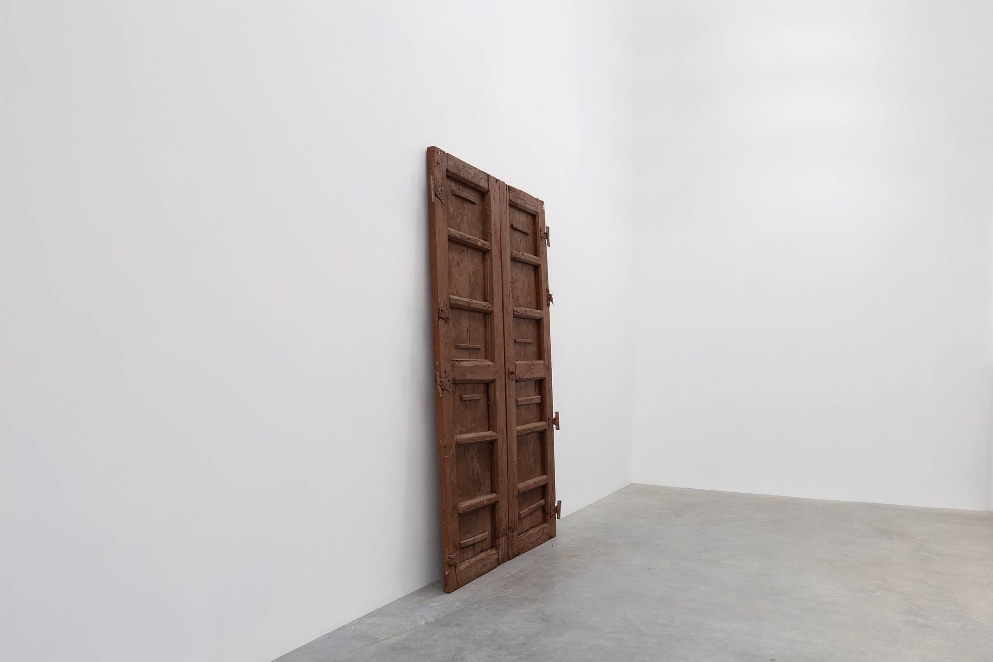 Large 17th century Monastery doors in terracotta lacquered oak, Portugal