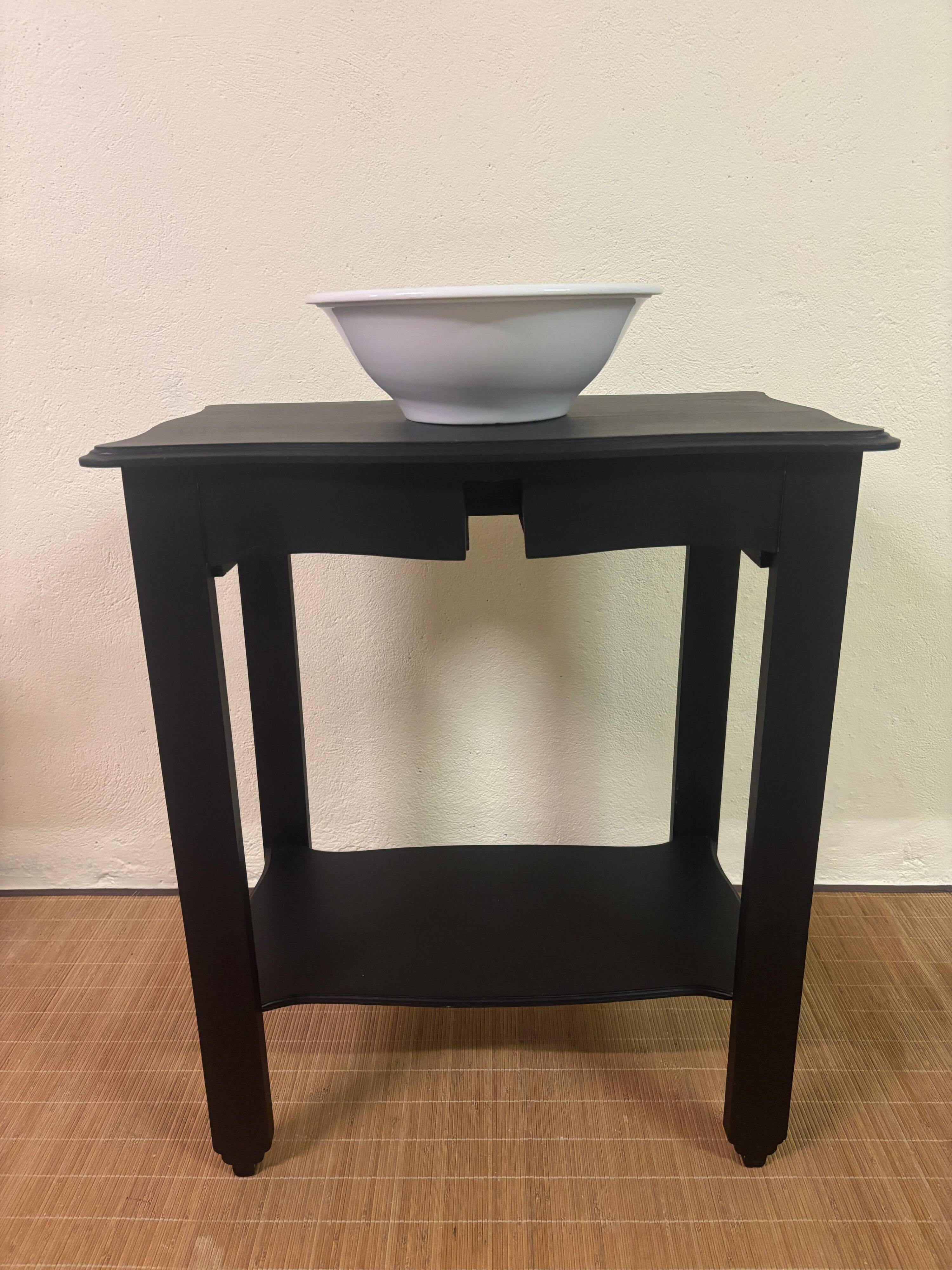 Small Art Deco console reinterpreted – matte black wood with drawer