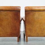 Ensemble de 2 fauteuils en cuir de mouton avec finition passepoil noir