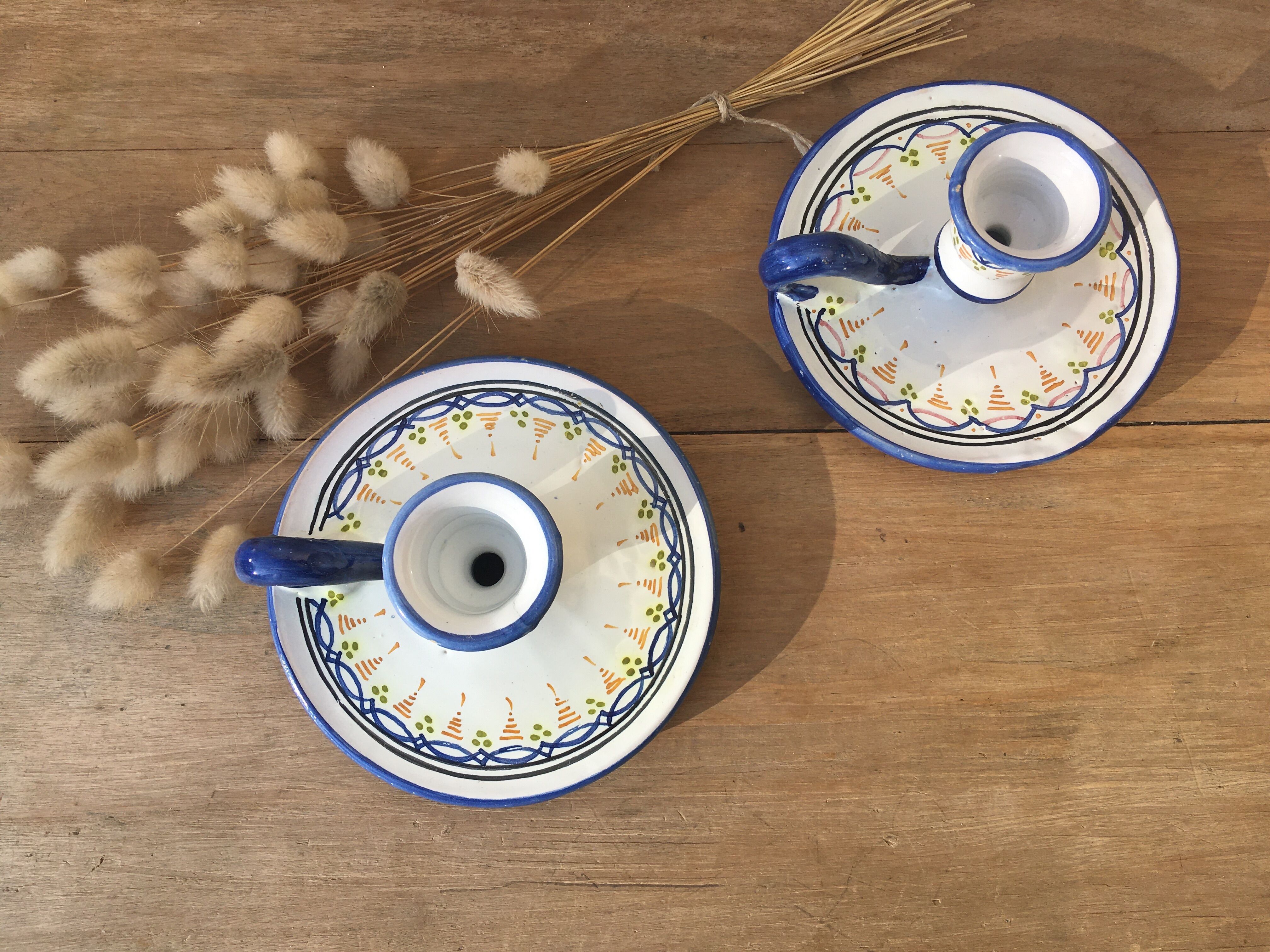 Pair of ceramic cellar rat candle holders