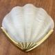 Shell-shaped wall light in Art Deco style with frosted glass and gilded bronze.