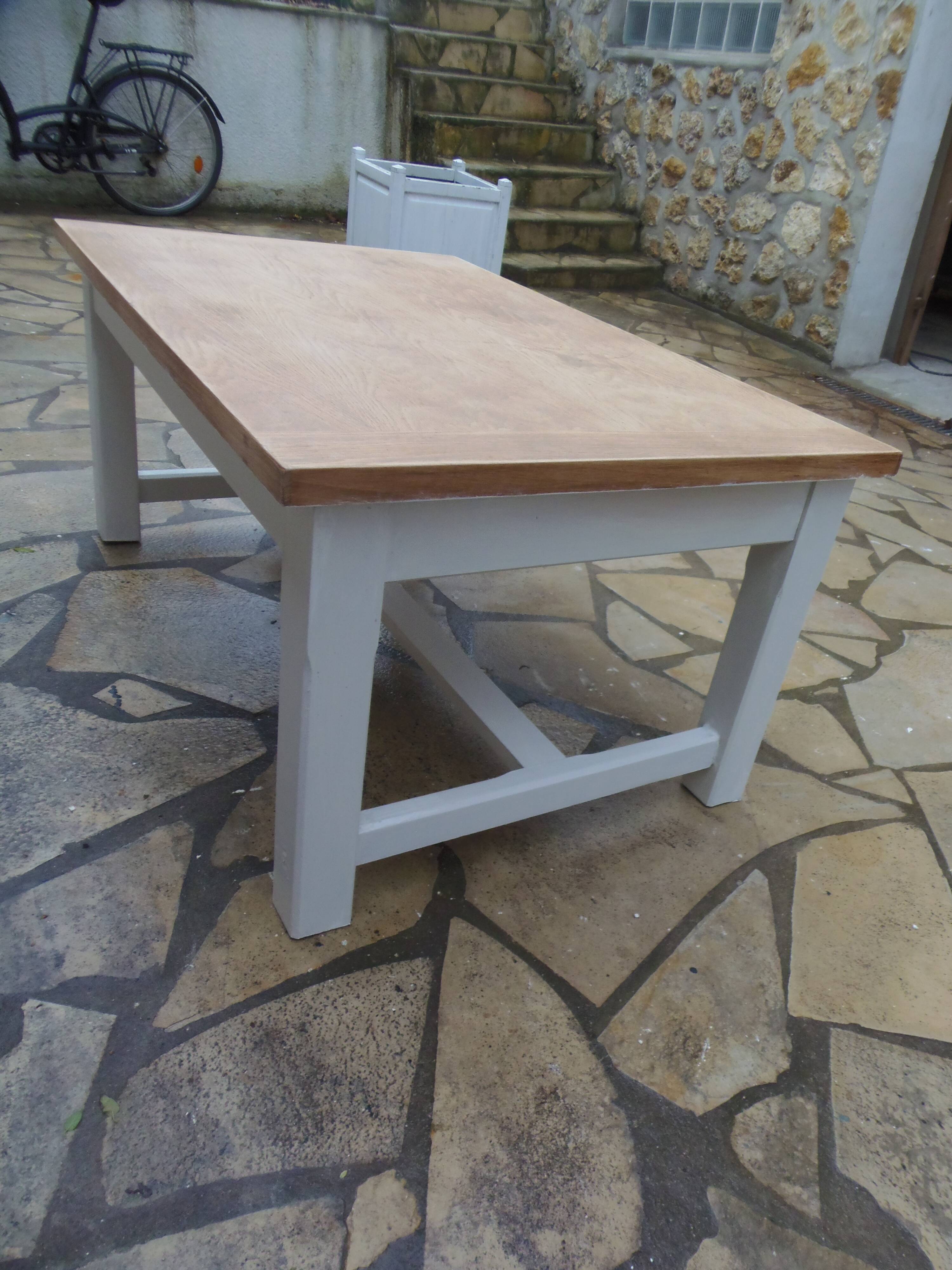 Coffee table with pearl grey legs and a wooden top.