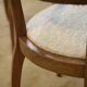 Pair of bridge armchairs in walnut and cream boucle fabric, early 20th century.
