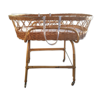 Rattan cradle with roulette rack