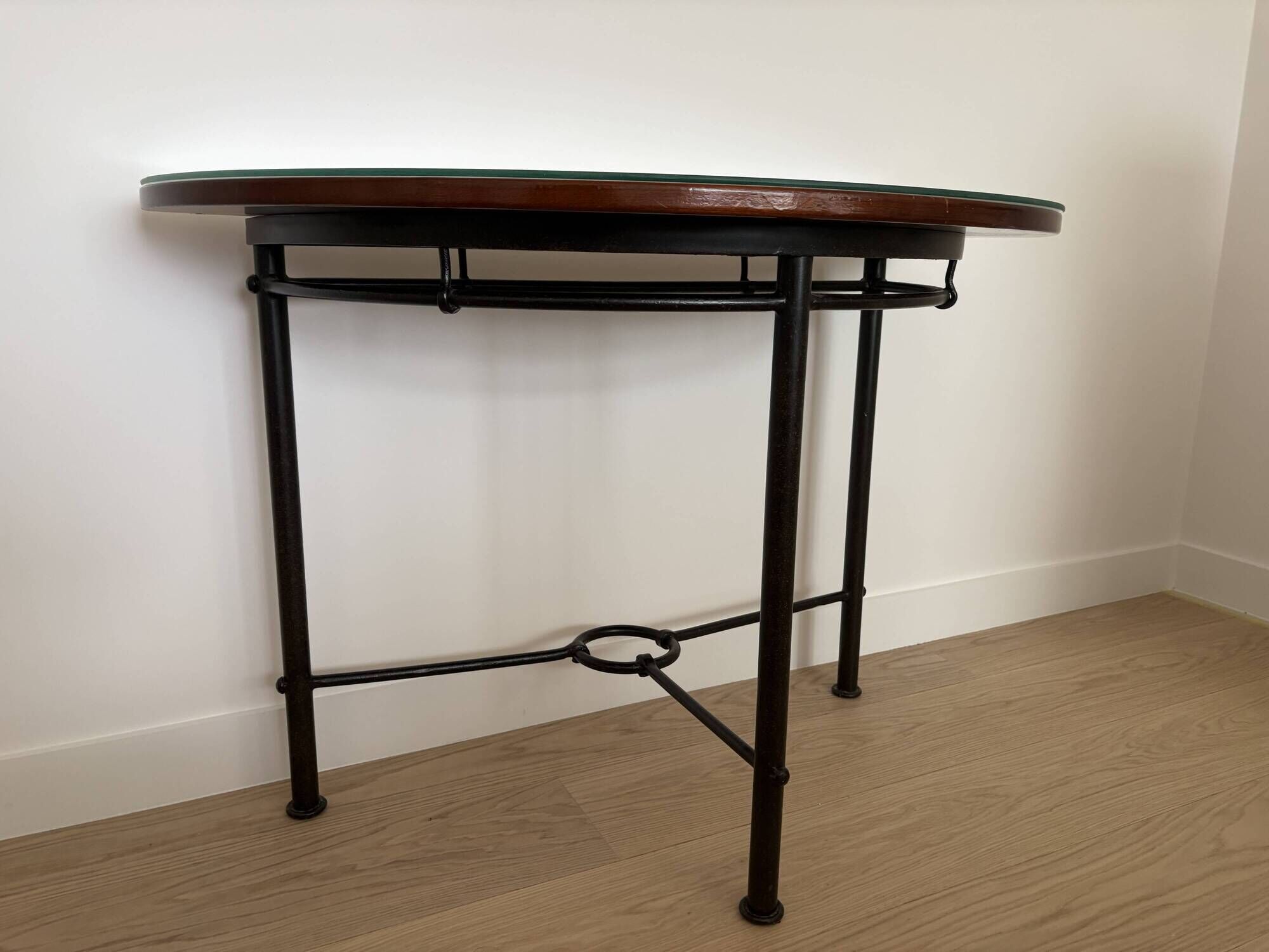 Half-moon console grange in solid cherry wood and wrought iron with a glass top.