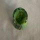 Single flower vase in blown green glass